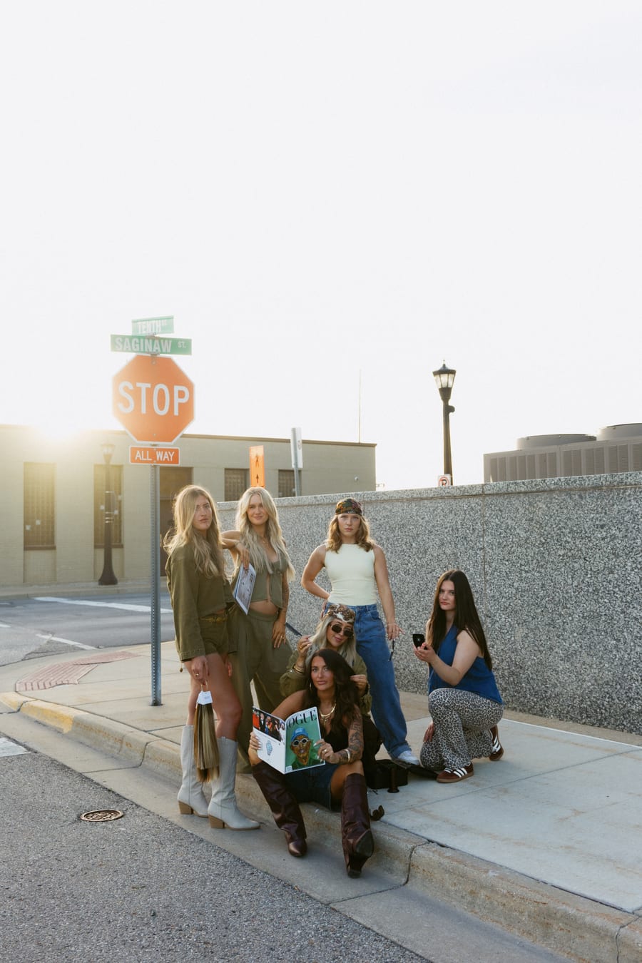 Wide Artistry Lounge team portrait glowing in the downtown sunset