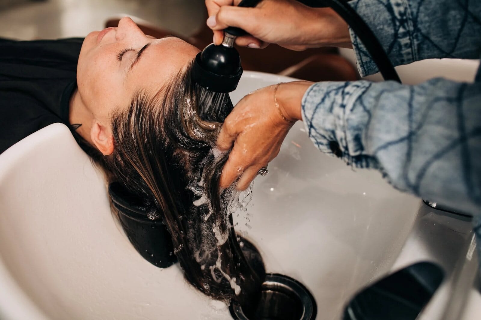 Stylist working with a guest at Artistry Lounge