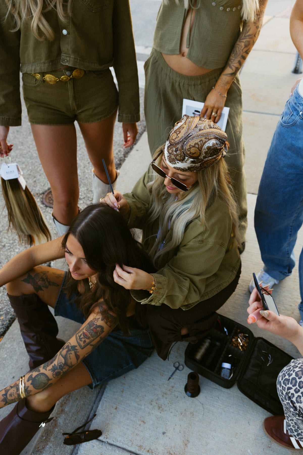 Artistry Lounge stylists collaborating on a downtown editorial hair look